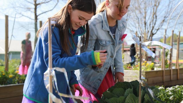 Hailey and Isla Manukura o te Taiao enviro leaders in the garden