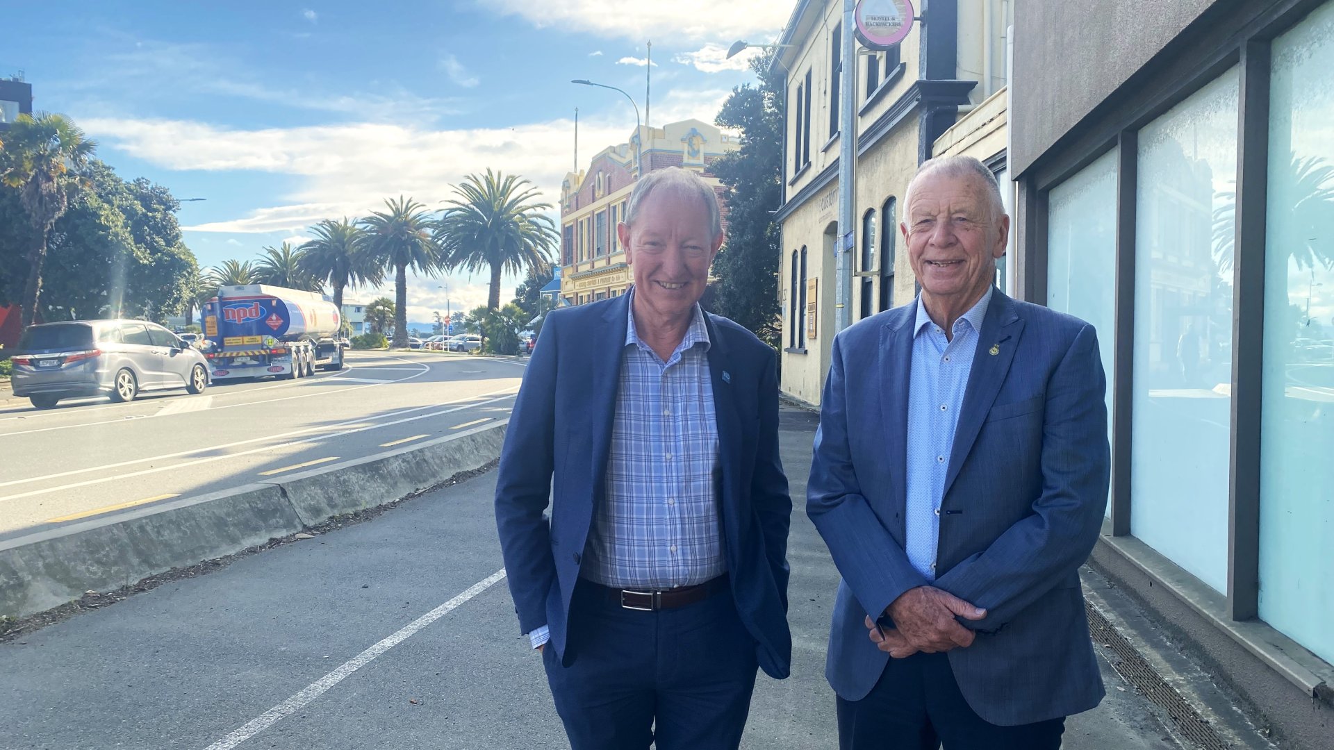 Nelson Mayor Nick Smith and Waterfront Redevelopment Taskforce Chair Councillor Mel Courtney on Haven Road with the Customhouse building behind them. 