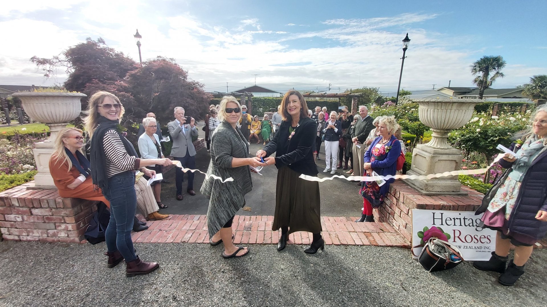 Mayor Rachel Reese and Nelmac’s Horticultural Parks Team Leader Kate Krawczyk cut the ribbon at the opening of the Broadgreen Heritage Rose Walk.