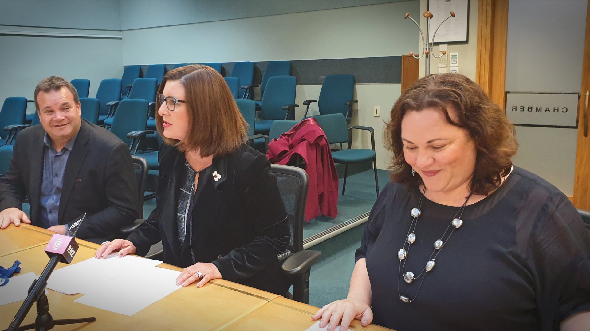 Photo: From left, Dale Bradley - Area Manager Kāinga Ora, Nelson Mayor Rachel Reese and Nelson MP Rachel Boyack discuss Community Housing in the Council Chamber.