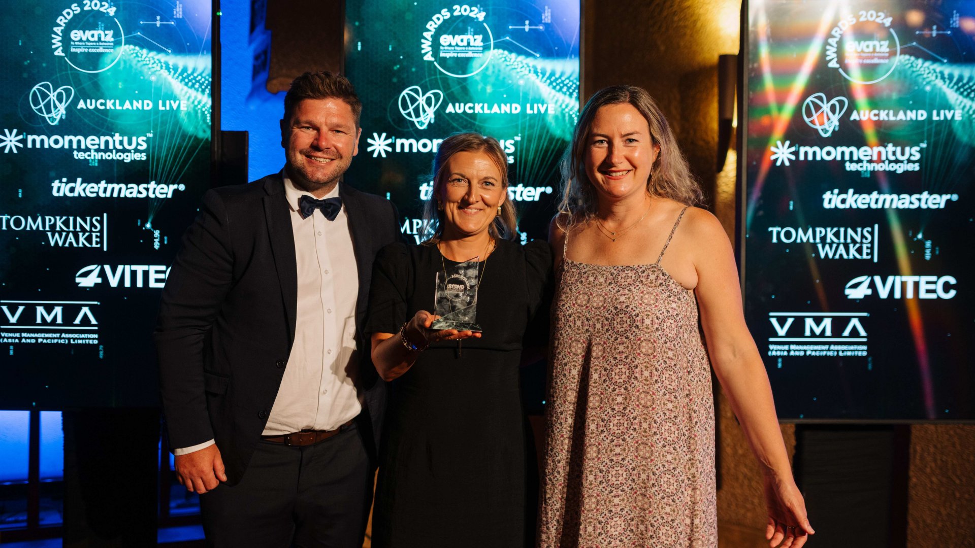 Photo Credit: EVANZ Board Member Alice Larmer (right) with Mark Mekalick (CLM) and Lynn Peacock (NCC) receiving the EVANZ Medium Venue of the Year Award.