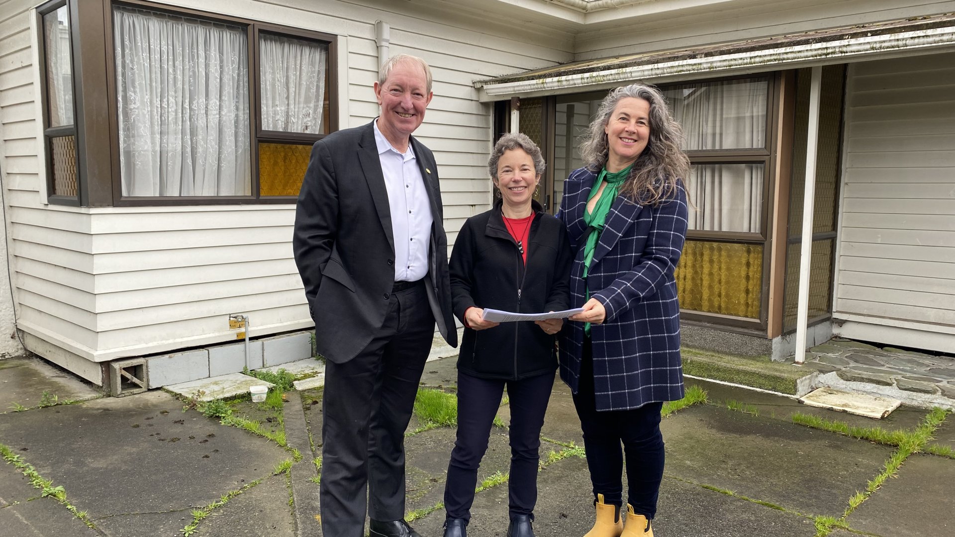 Caption details (left to right): Nelson Mayor Nick Smith, Nelson Tasman Housing Trust Director Carrie Mozena and Council’s Community Housing Acceleration Taskforce chair, Councillor Rachel Sanson with the Trust’s plans for the development of eight affordable rental properties on the site of two existing older houses at 163 Kawai Street South and 116 Waimea Road.