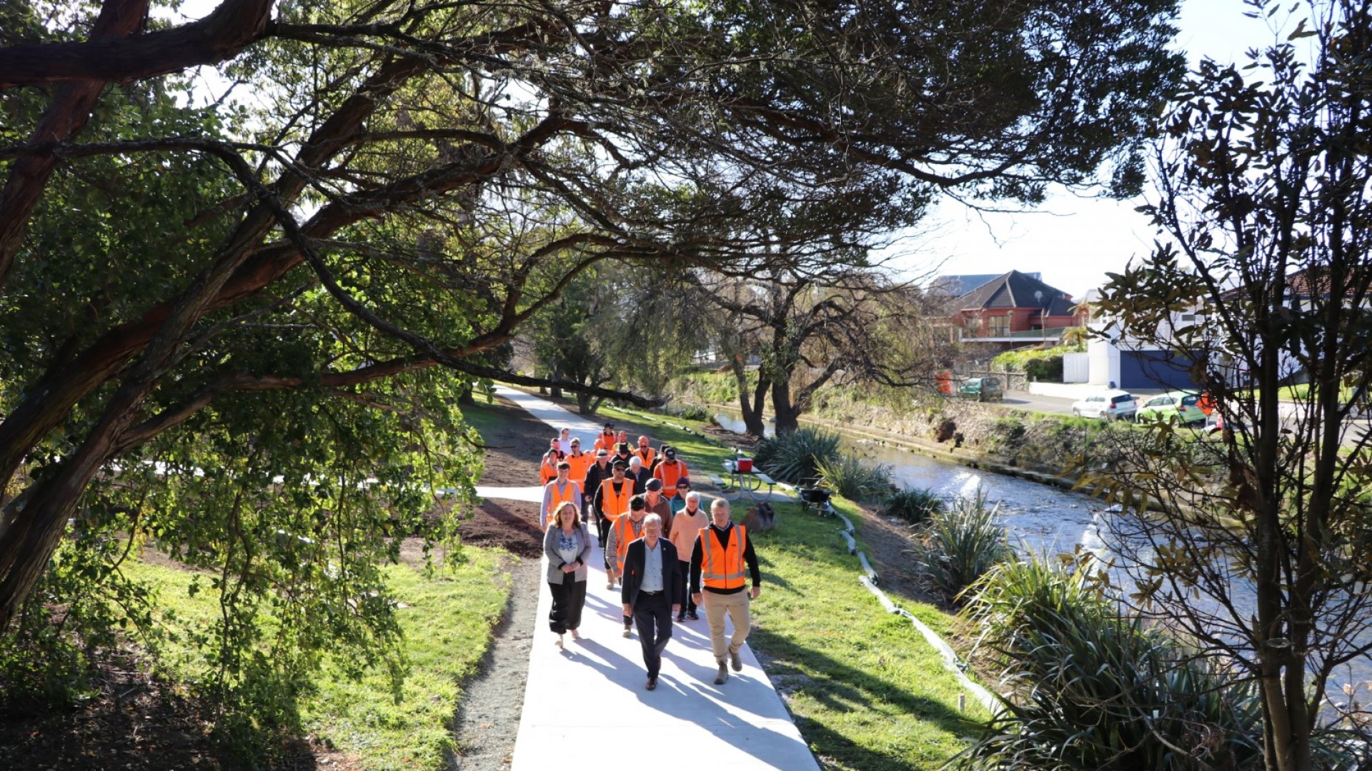Nelson Mayor Nick Smith, Nelson MP Rachel Boyack, residents of Domett Street and the team from Isaac Construction take a walk down the upgraded Maitai Shared Pathway on Domett Street. 