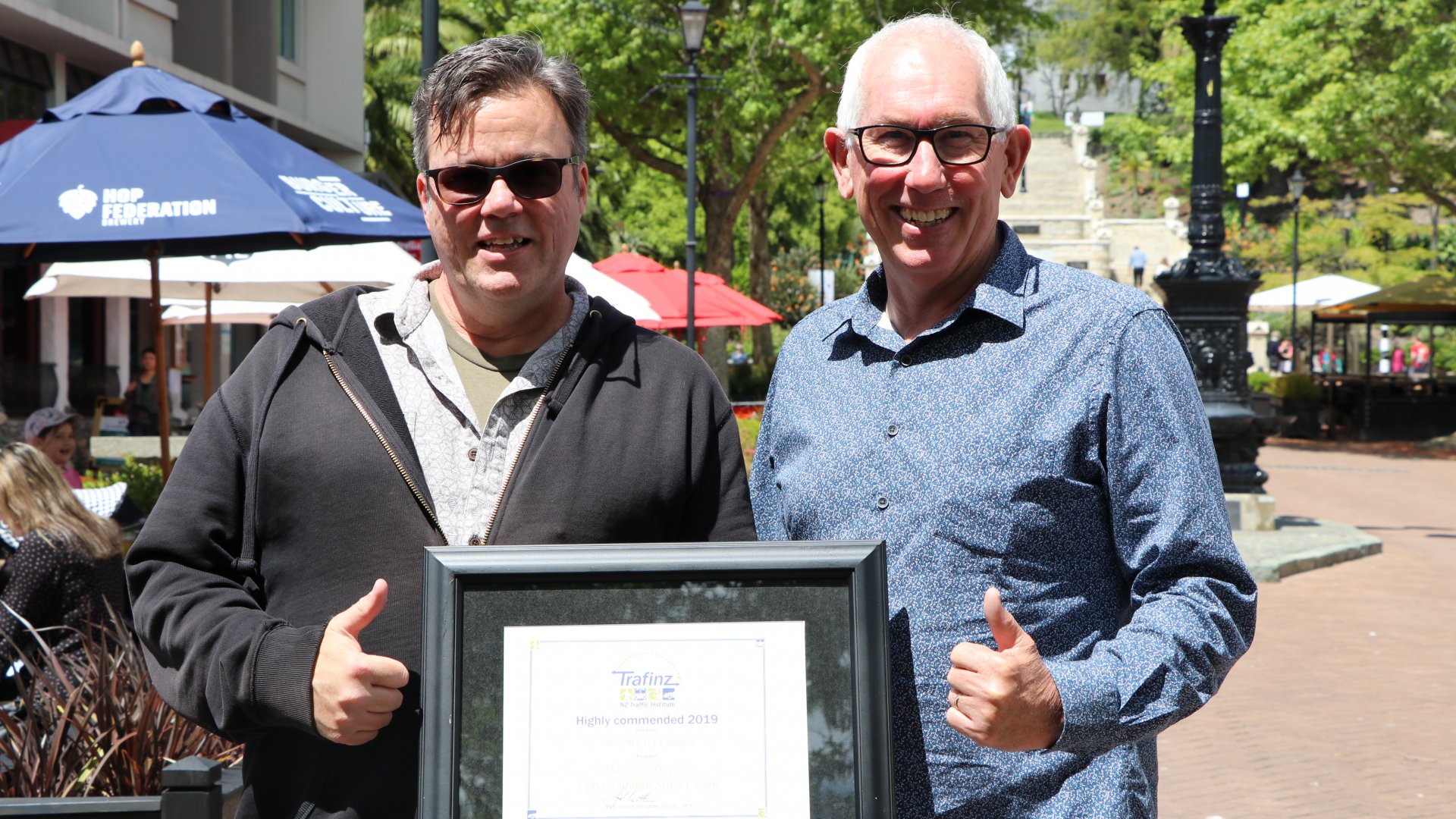 City Centre Development Programme Lead Alan Gray and Infrastructure Committee Chair Brian McGurk with the Award on Upper Trafalgar Street.