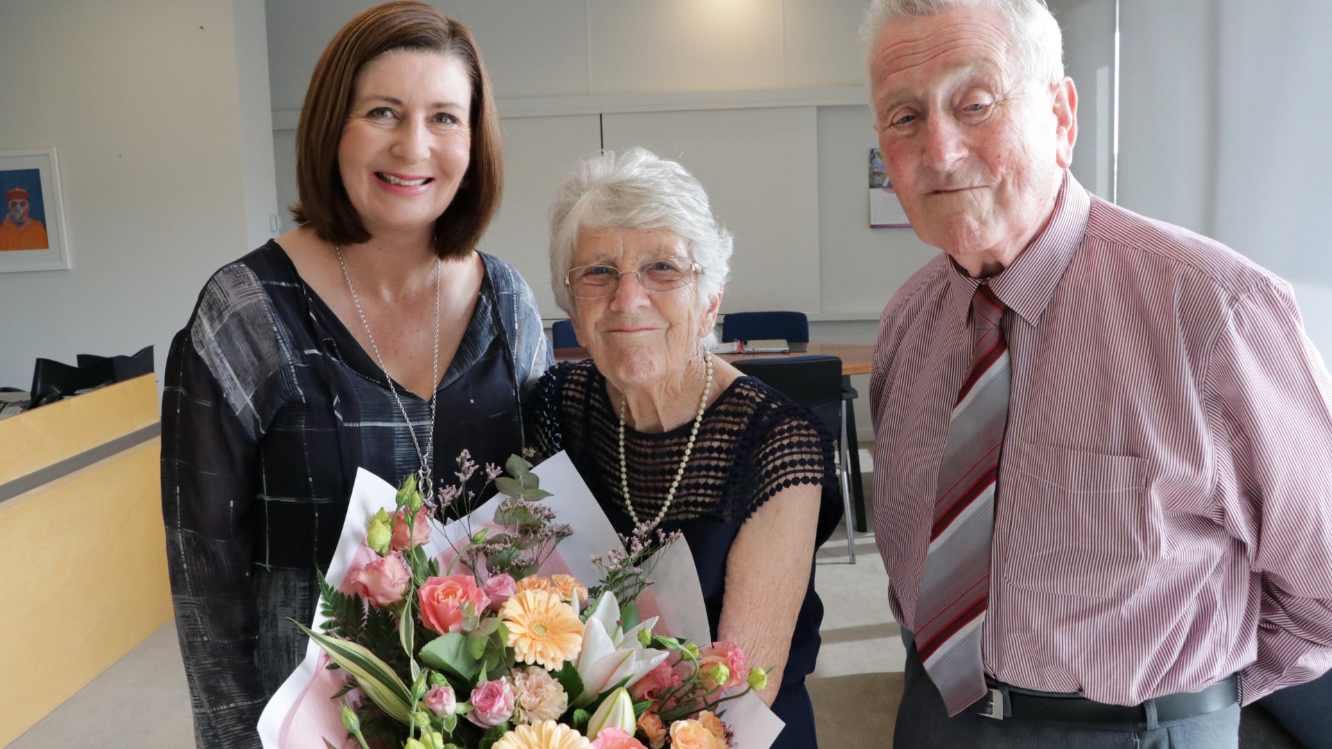 From left, Nelson Mayor Rachel Reese congratulates Janette Dimery, centre, with husband Peter Dimery, right.