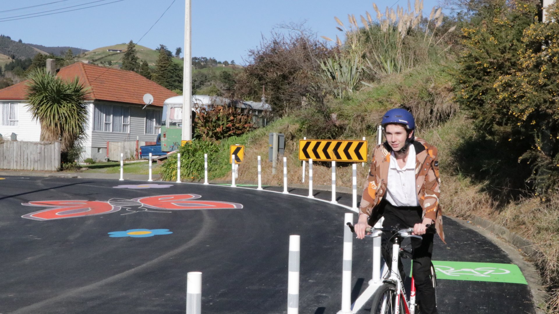 Councillor Rohan O'Neill-Stevens rides along the new cycleway on Tipahi Street. 
