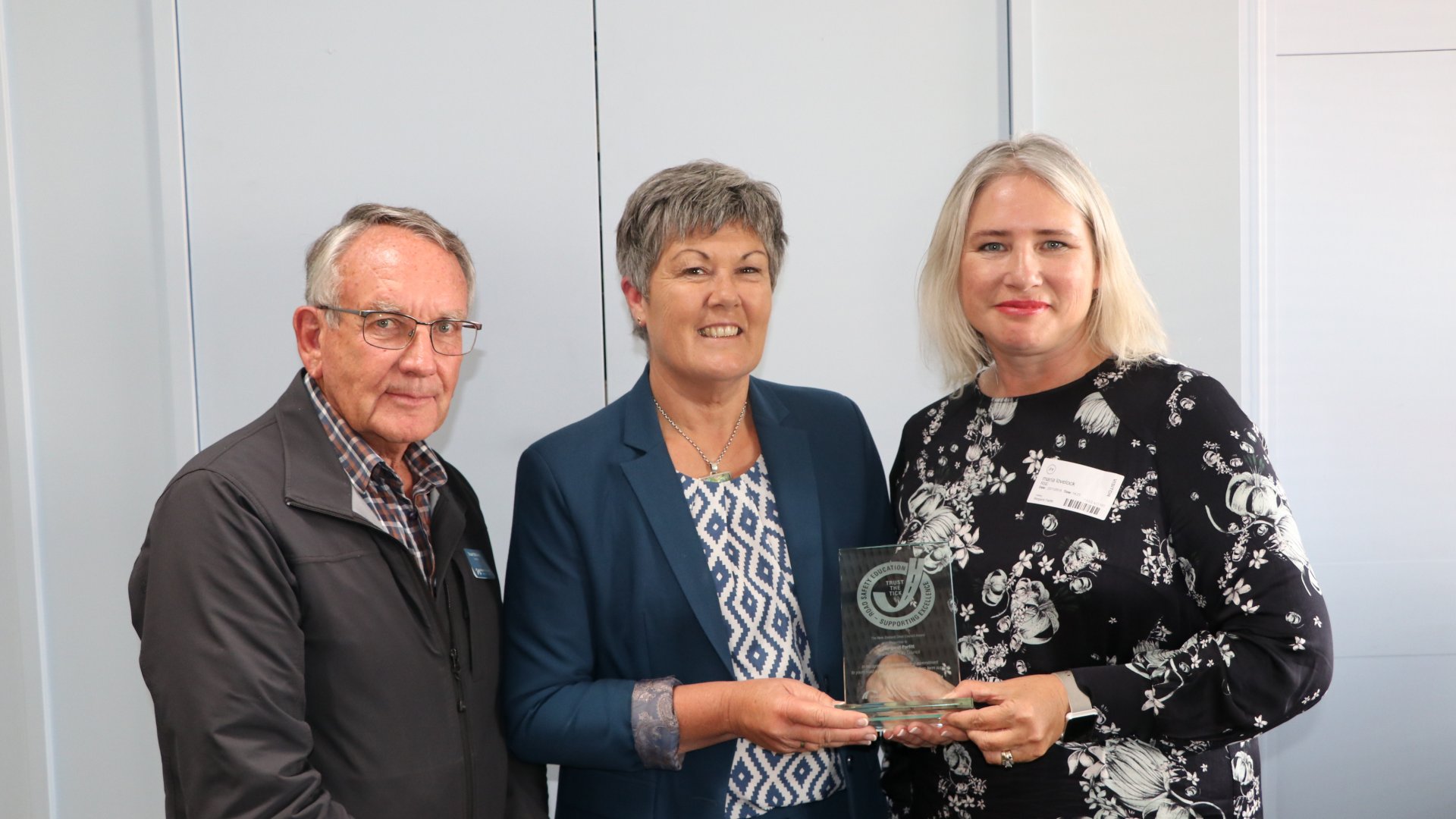 Councillor Stuart Walker (left) and Marg Parfitt (centre) are presented with the award by Maria Lovelock (right) from RSE. 