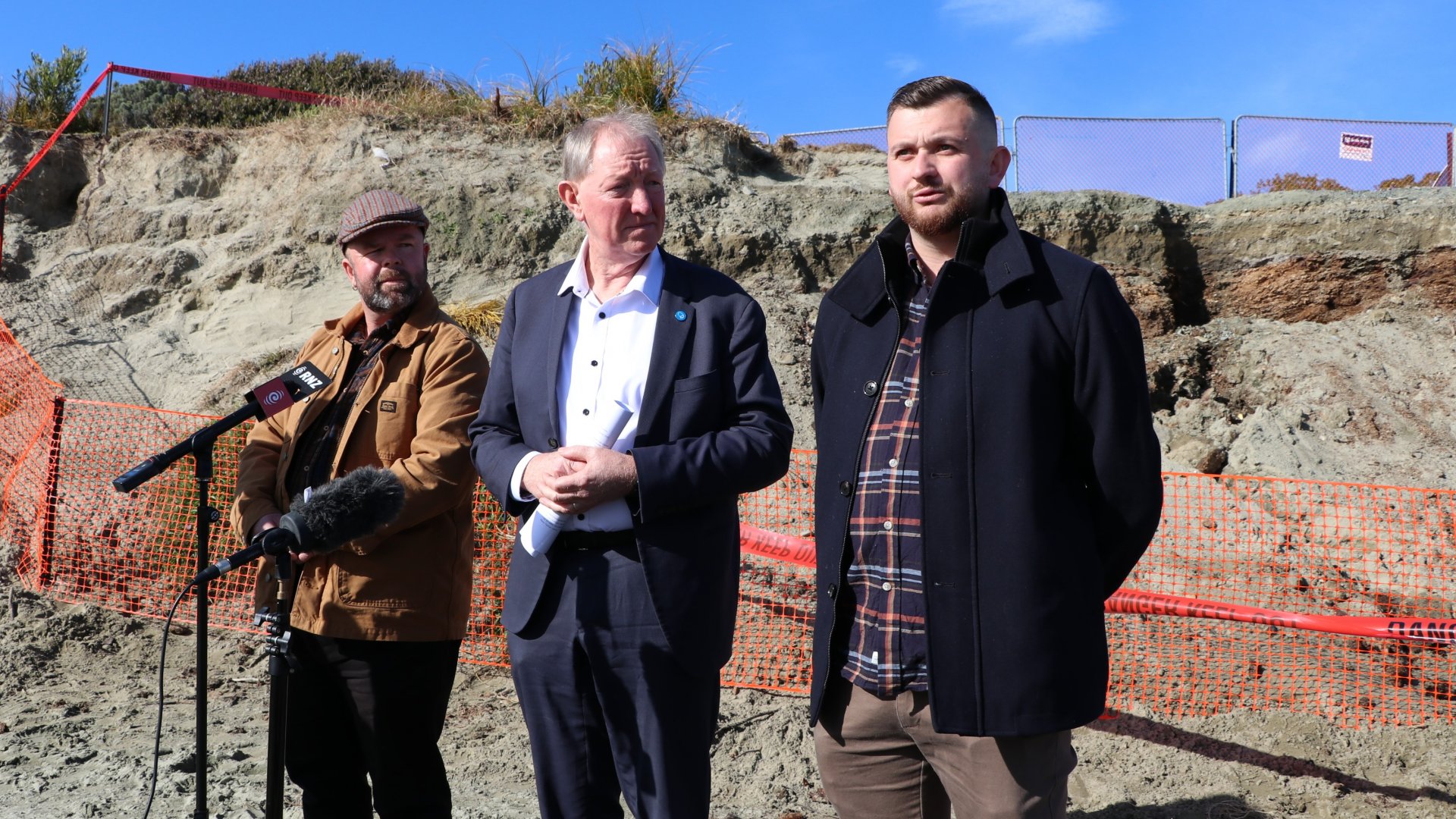 Nelson Mayor Nick Smith, centre, with Nelson City Council Group Manager Community Services Andrew White, left, and Councillor and Tāhunanui Liaison Councillor Campbell Rollo announce the findings from the latest tests of the sawdust pile at Tāhunanui back beach.