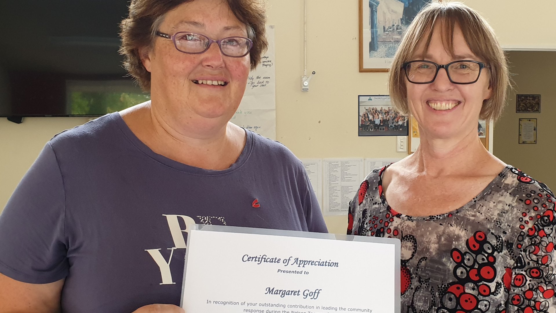 Margaret Goff, left, was presented with the Council award by Volunteer Nelson's Judene Edgar at Nayland Park Primary School recently. 