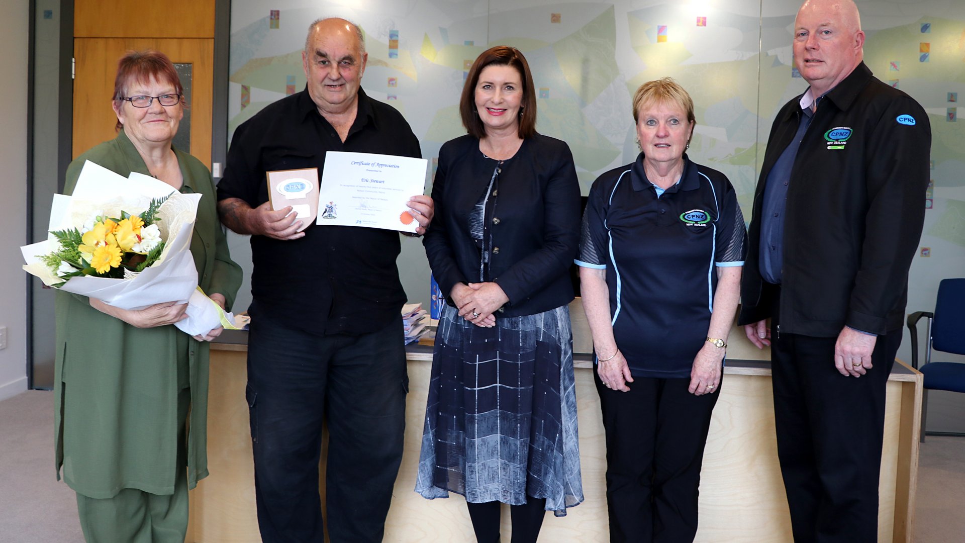 Caption: From left, Eric’s wife Faye, Eric, Mayor Reese, Patrol treasurer Liz Reeve, Patrol chairperson John Wyllie.