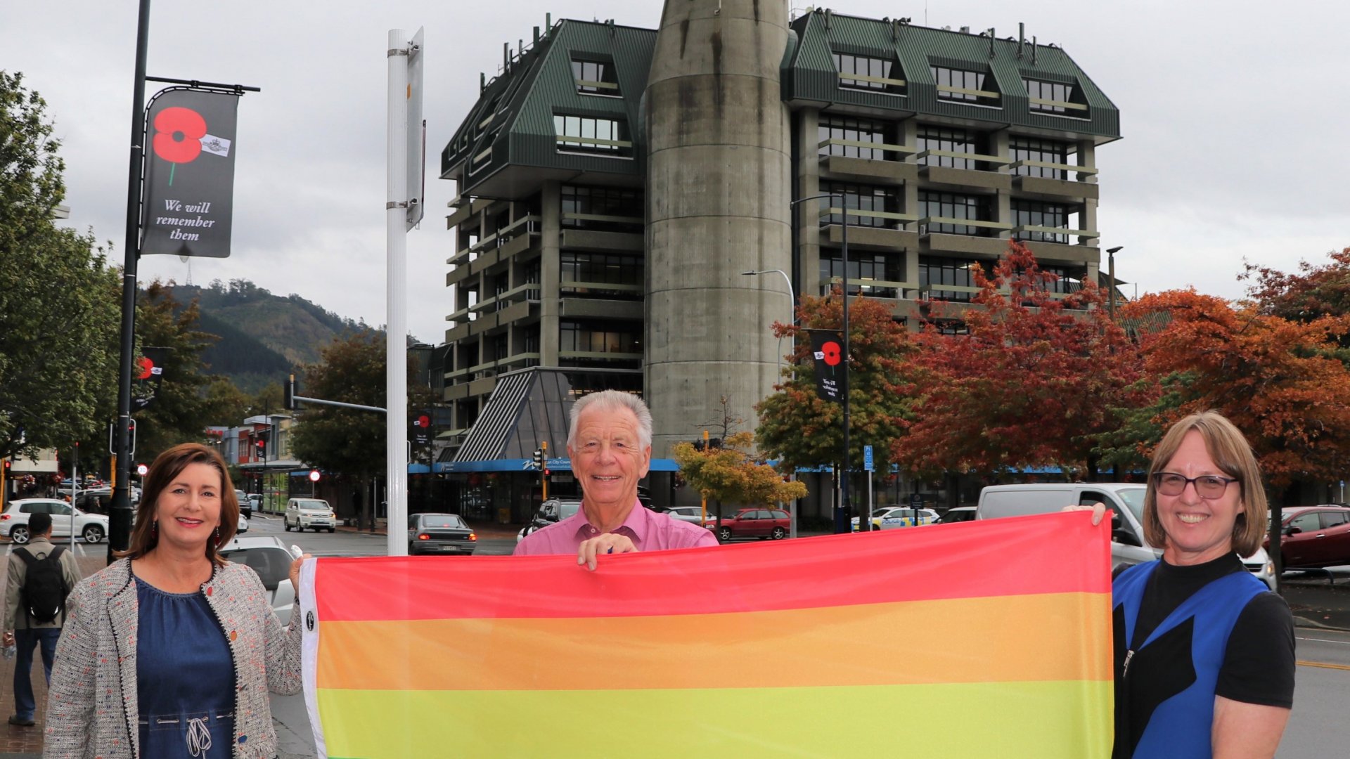 Mayor Rachel Reese, City Centre Engagement Group Chair Mel Courtney and Deputy Mayor Judene Edgar with the Pride flag, which will be flown on Civic House for Nelson Pride Week.
