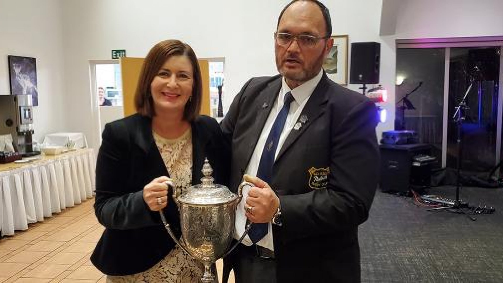 Nelson Mayor Rachel Reese and former Nelson Rugby Football Club president Shane Graham with the cup, at the club's 150th anniversary celebrations.