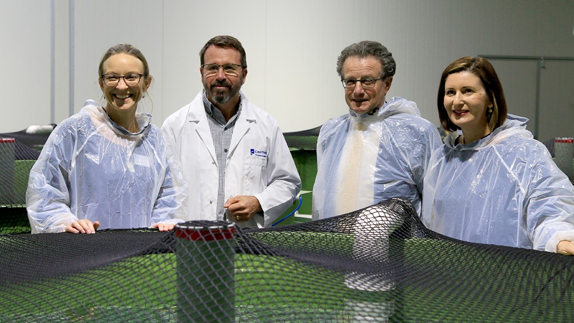 Dr Serean Adams, Kevin Heasman, Prof Charles Eason and Nelson Mayor Rachel Reese inside the Cawthron Finfish Research Centre. Credit: Bruce Green.