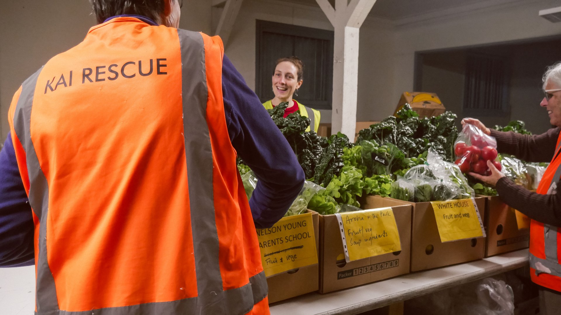 Kai Rescue volunteers pack food boxes for distribution. Photo: Amy Matheson