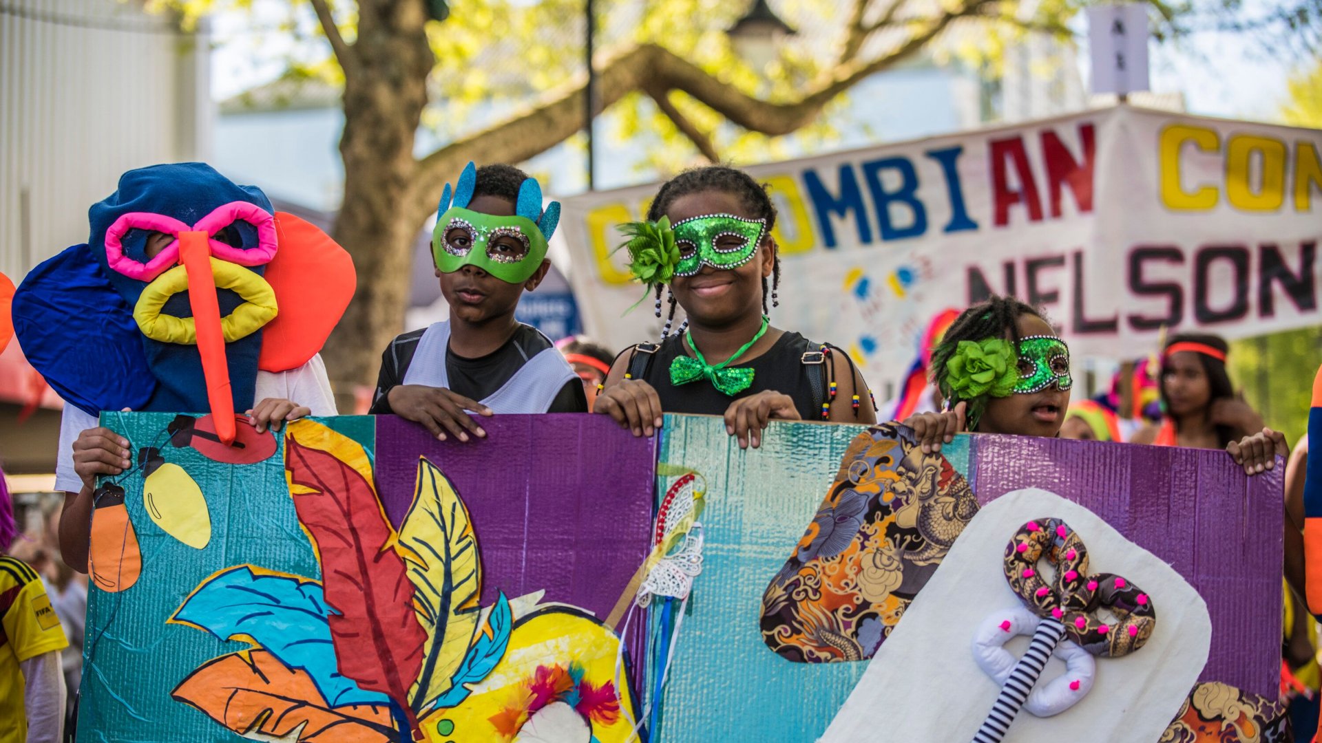 Caption: The Colombian Community won the non-school section of the Mask Parade.